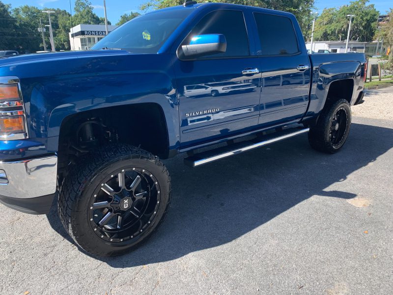 Blue Chevy Silverado lifted truck